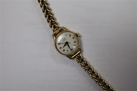 A ladys 1960s 9ct gold Tudor Royal manual wind wrist watch, on a 9ct gold bracelet.